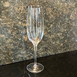 NWOT, Tiffany Champagne Glass, Crystal Clear, Gold Print Label is attached.
